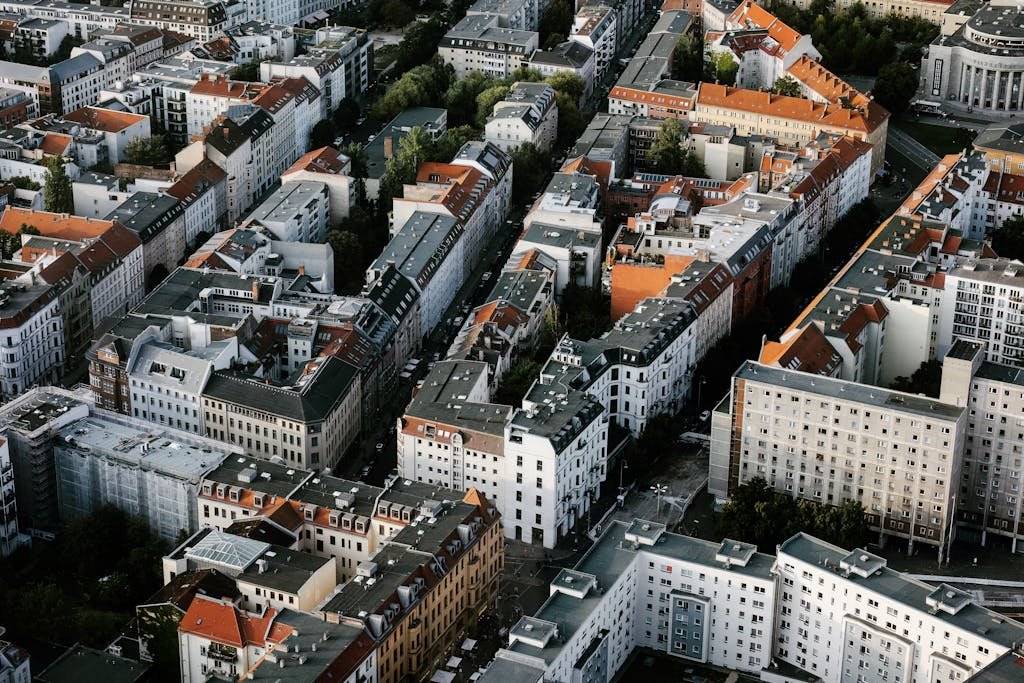 Drone shot showcasing the unique architecture and red rooftops of Berlin, Germany's urban landscape. Vegan neighborhoods.