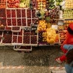 How To Easily Find Extraordinary Vegan Food In Any Country (Even When You Don't Speak the Language) Colorful vegan food spread at an international market.