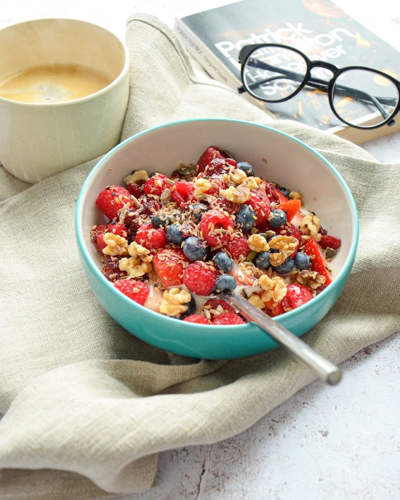 Delicious breakfast bowl with fresh berries, nuts, and milk for a healthy start to your day.