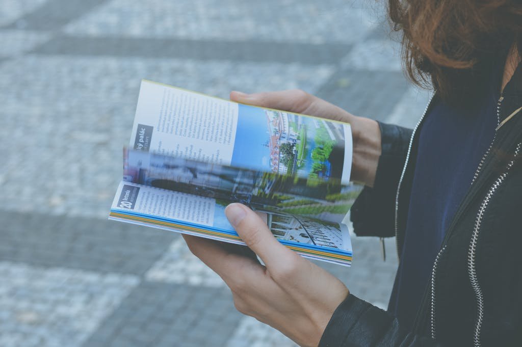 vegan reading a travel guide