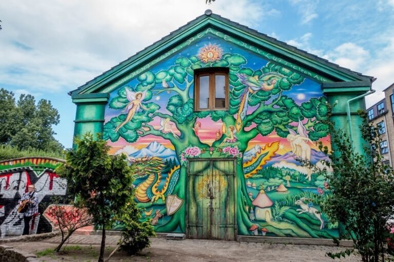 Colorful murals and alternative architecture inside Freetown Christiania in Copenhagen Denmark