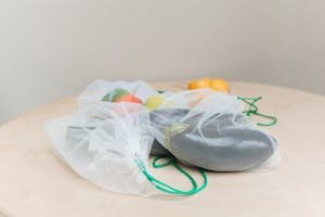 Eco-friendly produce in mesh bags promoting zero waste lifestyle.