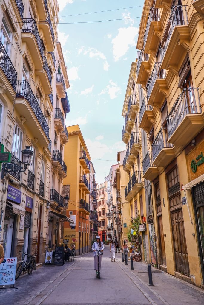 Picturesque street view in Valencia featuring historical architecture and vibrant atmosphere and vegan travel in Spain.