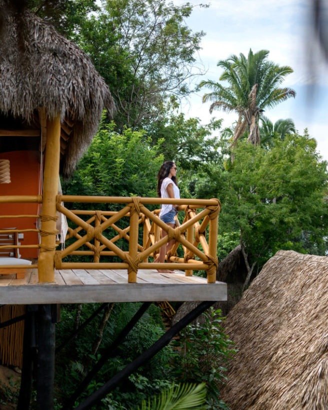 Palapa-roofed yoga studio overlooking the Pacific Ocean at Xinalani Retreat in Mexico