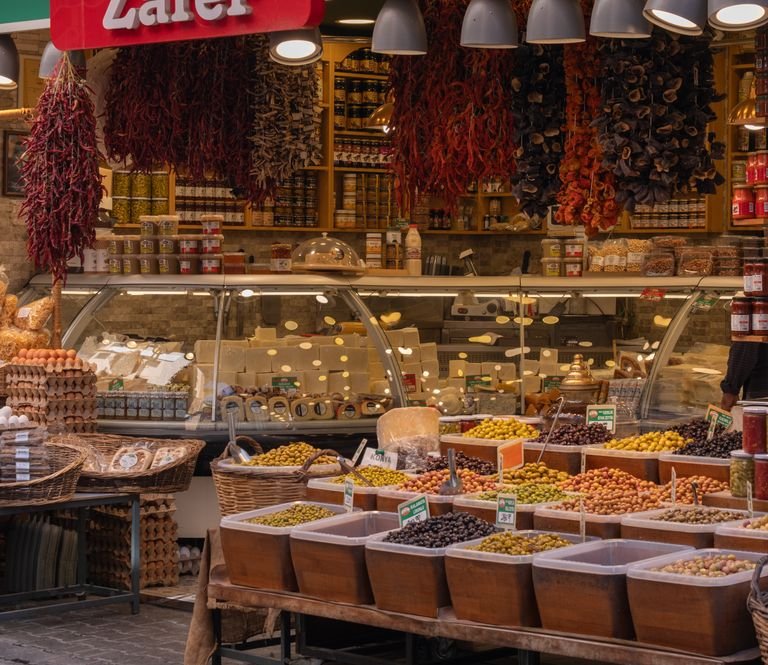 Fresh produce and pickled vegetables at an outdoor market in vegan Eastern Europe