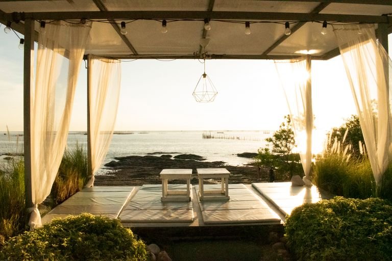 Open-air yoga shala overlooking the ocean at a vegan eco-retreats