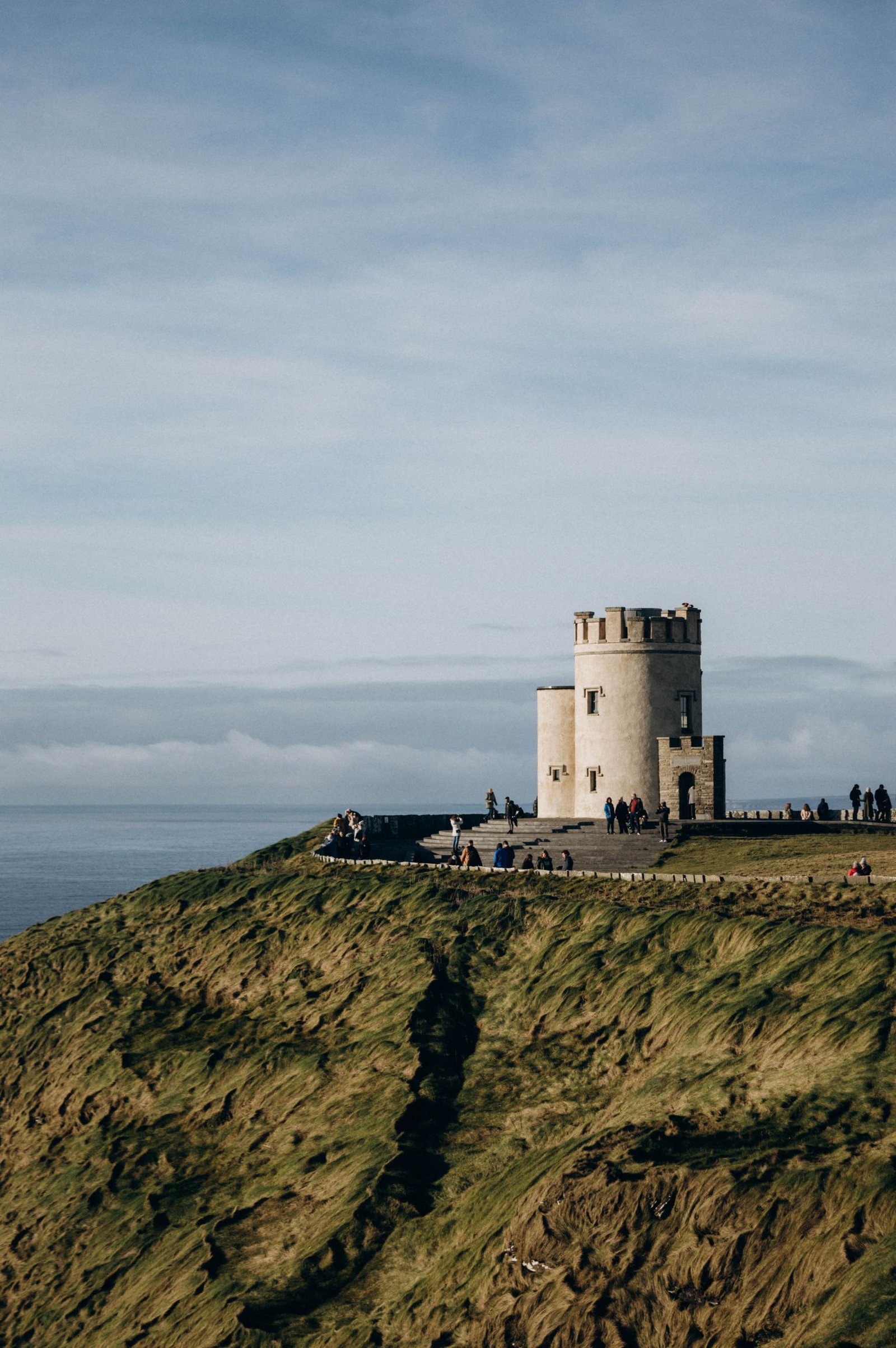 O'Brien's Tower atop the Cliffs of Moher with a scenic ocean view, showcasing historical architecture.