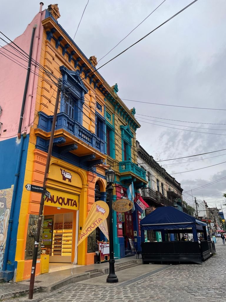 Vibrant street scene with colorful buildings in Caminito, Buenos Aires, Argentina. Underrated vegan travel destinations.