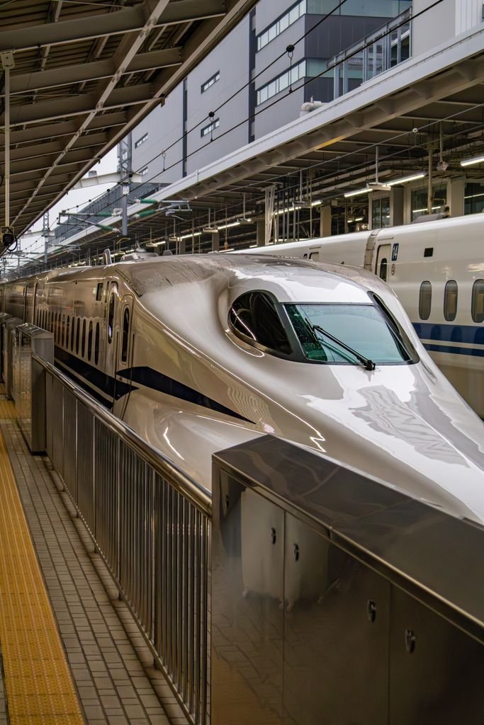 A sleek Shinkansen bullet train at Nagoya Station, capturing modern Japanese transportation.