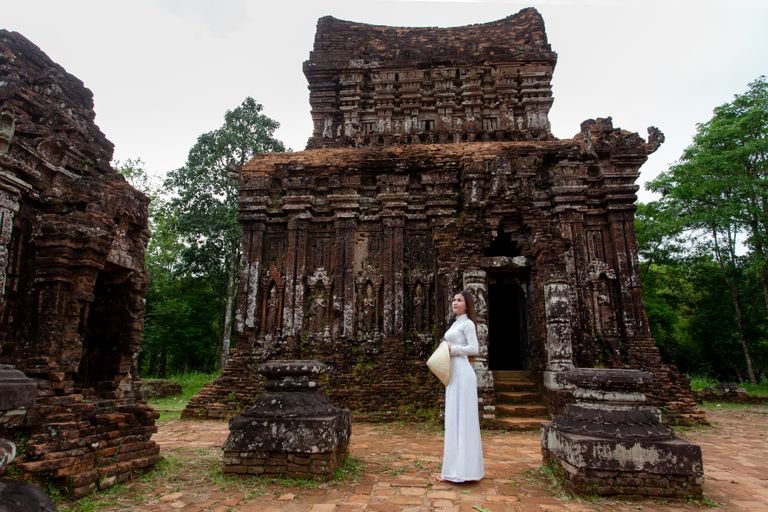 Unusual vegan travel experiences hero image showing a traveler at a sanctuary in Quang Nam.